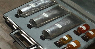 Three Killing Bottles in Ken Hayata's briefcase in The Killing Bottle