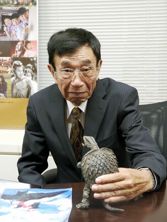 Yonesaburo Tsukiji with a Gamera figure in 2010