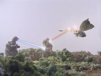 Godzilla and Mothra Leo blasting Hedorah