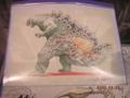 An object resembling an egg attached to Godzilla's back