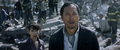 Dr. Graham and Dr. Serizawa watch as Godzilla regains consciousness.