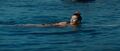 Saeko swimming just before she is spotted by Goro Maki