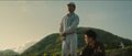 Saito talking to Shikishima on the Odo Island shoreline