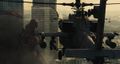 A JASDF AH-64 Apache fires on Godzilla near the Tama River.