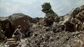 LittleGodzilla appears over a hill and looks down at Akira Yuki