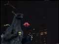 Godzilla lets go of Torema's ship as she flies away