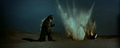 The missiles explode around Godzilla