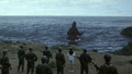A weakened Godzilla retreats to the sea