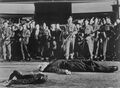 TV promotional still of Decker and Konga lying dead