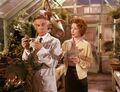 Promotional still of Decker & Margaret in the greenhouse