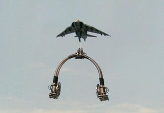 The Mind-Destruction Coil being carried by a jet in Monster X Strikes Back: Attack the G8 Summit