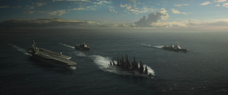 The USS Saratoga (far left) tailing Godzilla in Godzilla (2014)