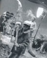 Teruyoshi Nakano holds the Gigan arm model on the set of Godzilla vs. Gigan