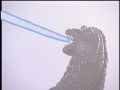 Godzilla fires his ray at Rodan