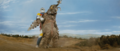 Jet Jaguar holds Megalon still