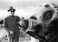 Eiji Tsuburaya poses next to the 33-shaku-long Mothra larva costume.