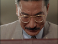 Takeshi Tomokane looks down at the Cosmos after Ando delivers them to him