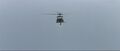 The helicopter flying above the Pacific Ocean