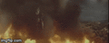 Jet Jaguar flies himself and Godzilla out of the fire