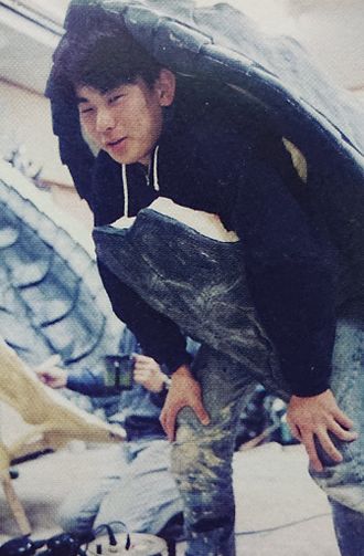 Hidenori Yamaoka test-fitting Gamera's shell for Gamera the Guardian of the Universe