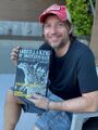 Edwards holding a copy of Godzilla - King of Monstermaker