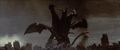 Keizer Ghidorah stomps on Godzilla