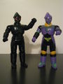 Black, green-flecked, gold-trimmed Jet Jaguar with red eyes (left) and Evangelion Unit-01 colors Jet Jaguar (right)