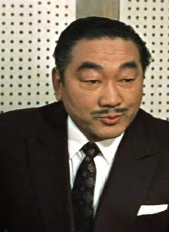 Tetsu Nakamura as Clark Nelson's henchman in Mothra