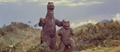 Godzilla and Minilla watch Gabara retreat
