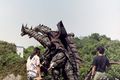 Nobuhiro Ekubo (left) with the Desghidorah suit during filming of Rebirth of Mothra