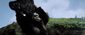 Kong throws a boulder at Godzilla