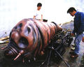 The Mothra larva prop is prepared for filming.