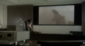 Yasuaki Shindo watches the battle on a television screen