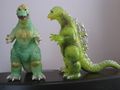 Glow-in-the-dark Godzilla 1964 (left) and translucent green Godzilla 1964 (right)