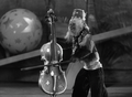 A Musical Monkey who plays a violin as if it was a bass