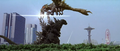 Godzilla uses his dorsal plates to cut into Megaguirus as she flies past