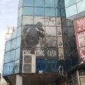 A faded King Kong Cash advertisement in Belgrade, Serbia
