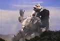 Godzilla grabs Mechagodzilla and holds it tightly
