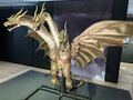 The Grand King Ghidorah suit on display in 2025