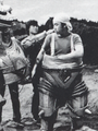 Kazunari Mori is helped into the Mechagodzilla 2 suit on the set of Terror of Mechagodzilla