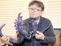 Shin Godzilla co-director Shinji Higuchi holding a King of the Monsters Series Godzilla 2016 Climax Ver. and a MMS Godzilla 2016 figures