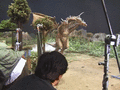 Tsutomu Kitagawa runs and jumps in the Cretaceous King Ghidorah suit, facilitated by the lightweight construction of the suit.