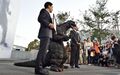 Setagaya mayor Nobuto Hosaka presents Godzilla with a certificate on November 3, his 60th birthday