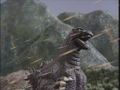 Godzilla getting attacked by Gororin