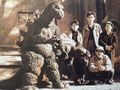 From left: Yoshio Suzuki, Kaimai, Teizo Toshimitsu, and Yasuei Yagi with the Tyrannosaurus rex and Ankylosaurus suits for The Volcano Monsters