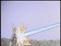 Gigan is hit from behind by the ray