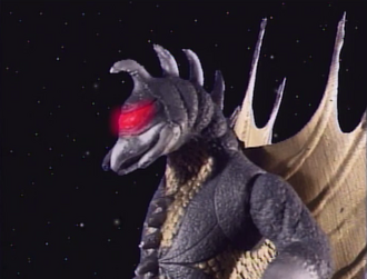 Gigan preparing to fire an arrow from his eye