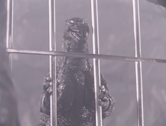 Godzilla imprisoned in a G-Guard cell
