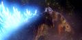 Mothra releases her scales to impede Godzilla's atomic breath