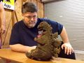 Mark Jaramillo looks at Godzilla's concept maquette for Son of Godzilla in 2014.